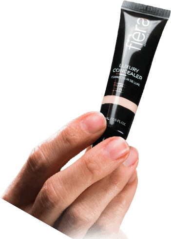 Hand holding concealer tube